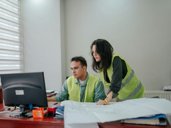 people working at a computer in an office